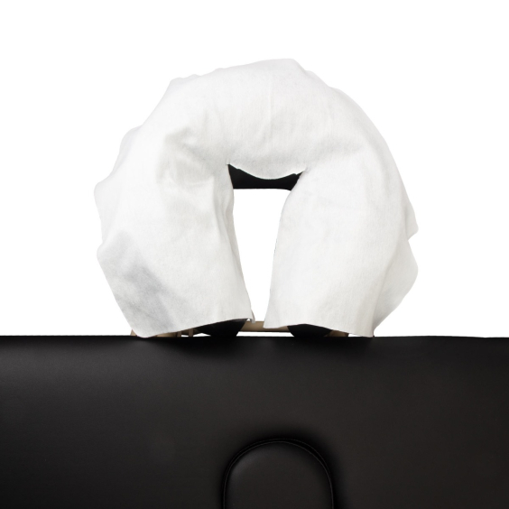 Disposable white head rest cover placed on black chair face cradle pack of 100